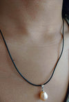 Collier cordon noir avec pendentif rosé